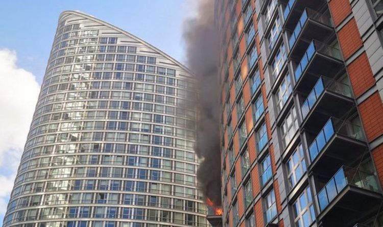 Smoke coming from a building on fire in Poplar, East London, UK
