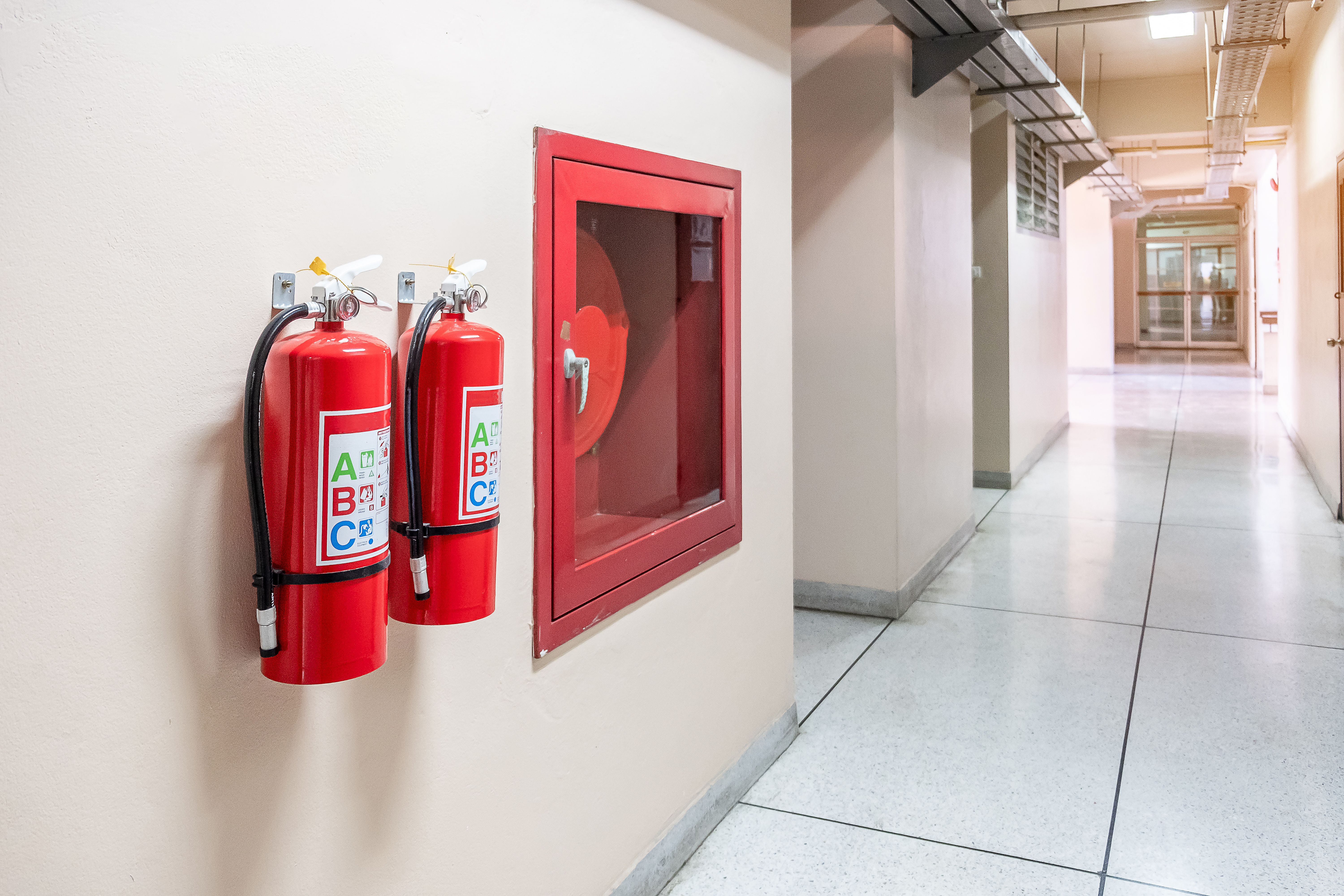 Photo of Fire Extinguisher System Wall Background Powerful Emergency Equipment Industrial