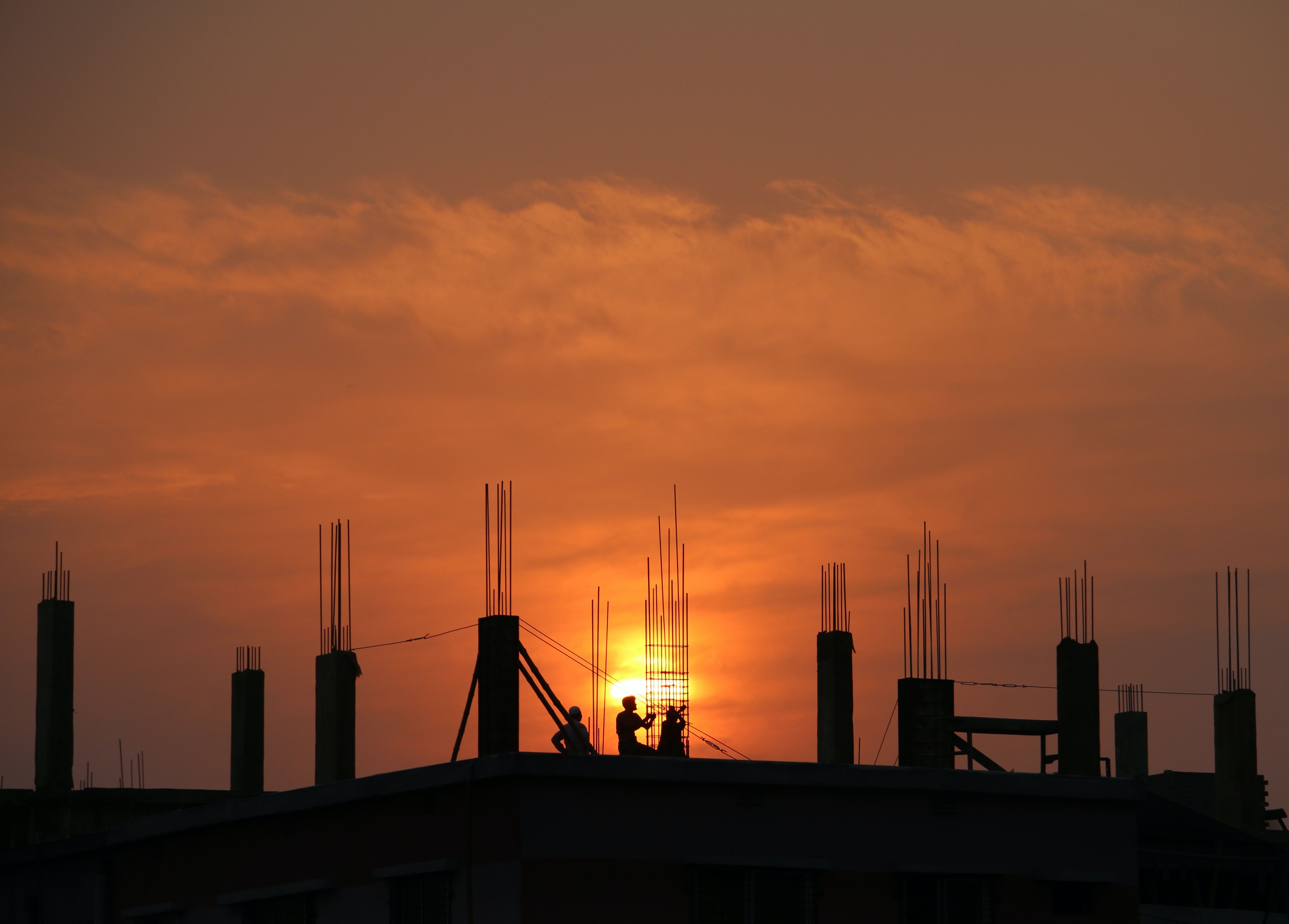 Photo of construction during sunset